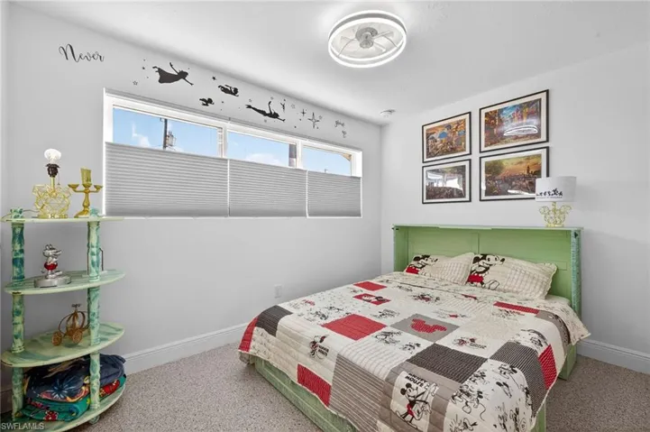 Bedroom with baseboards and speckled floor