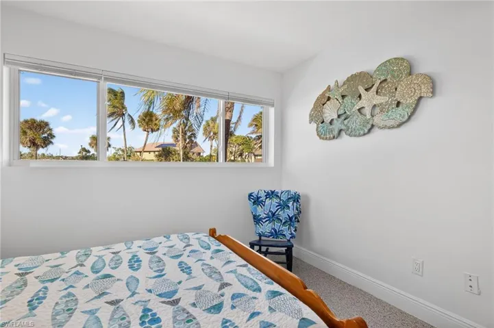 Carpeted bedroom with baseboards