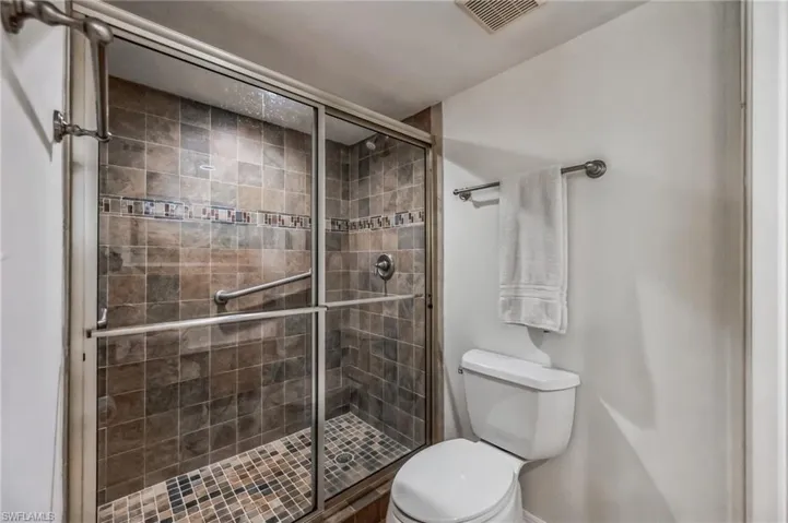 Full bath featuring a stall shower