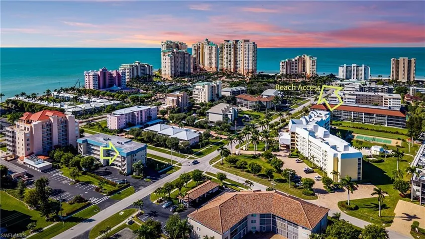 Aerial perspective showcasing a coastal community with expansive ocean frontage