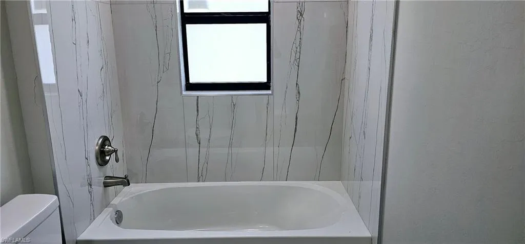 Full bath with toilet and bathing tub / shower combination