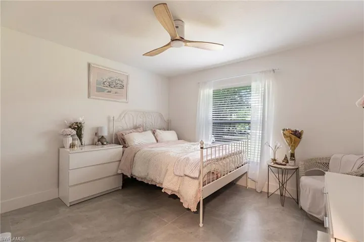 Bedroom with baseboards and ceiling fan