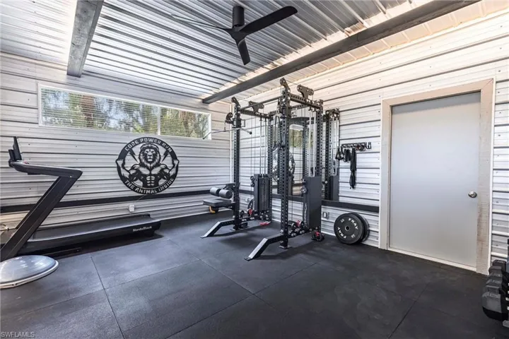 Workout area featuring a ceiling fan