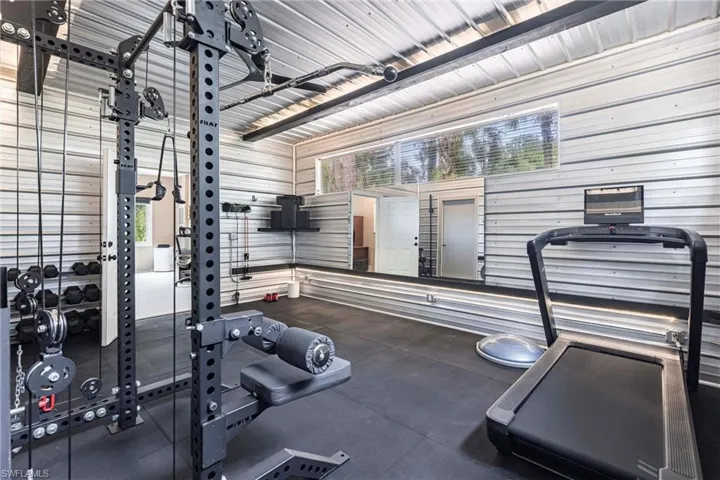 Workout area featuring wooden walls