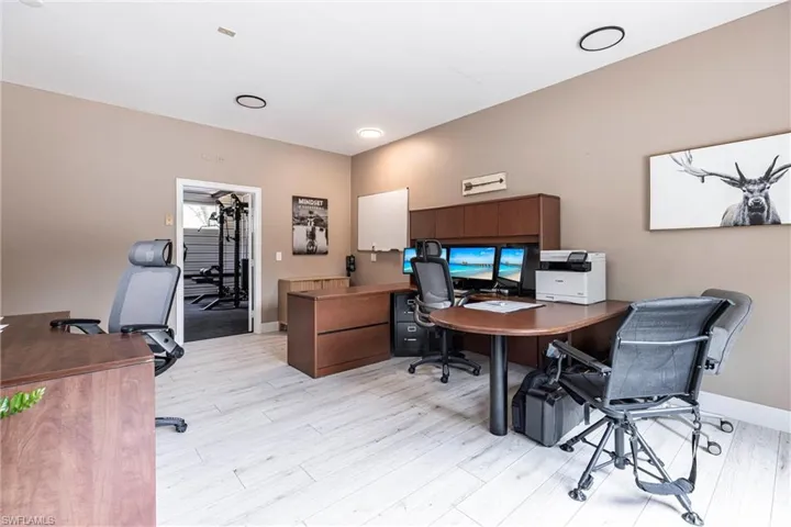 Outside Home office featuring light wood-style floors and baseboards