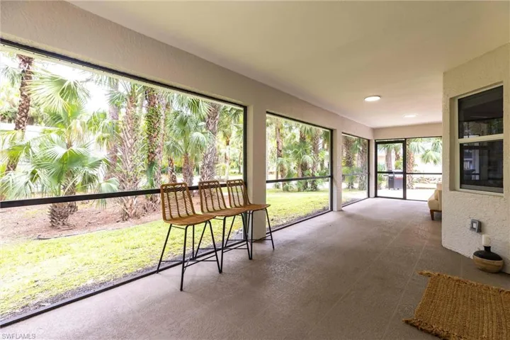 Unfurnished sunroom with recessed lighting