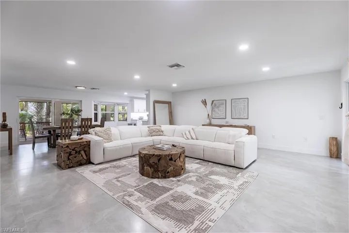 Living room with recessed lighting and baseboards