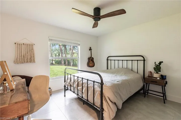 Bedroom featuring a ceiling fan and light tile patterned floors