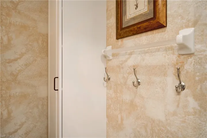 Room details featuring an enclosed shower