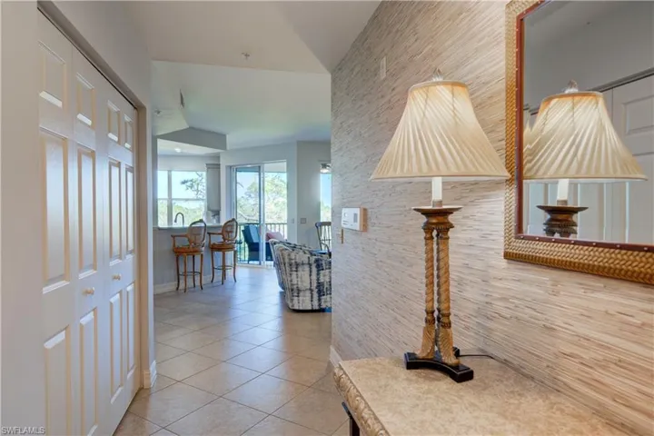 Hallway featuring tile patterned flooring