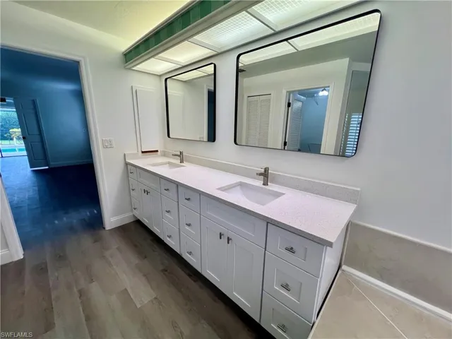 Primary Bathroom with dual sinks and vanity.