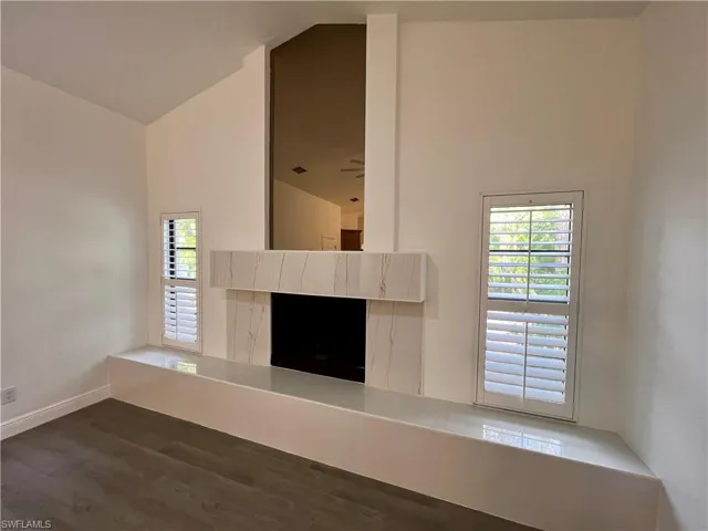 Fireplace in Family room with marble like finishes.