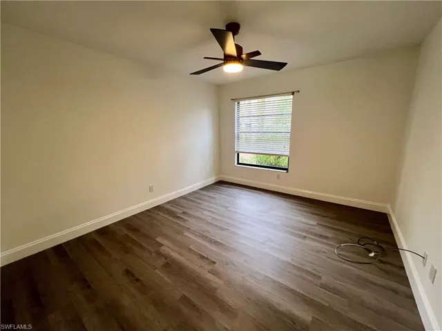 Guest bedroom with luxury vinyl plank floors.