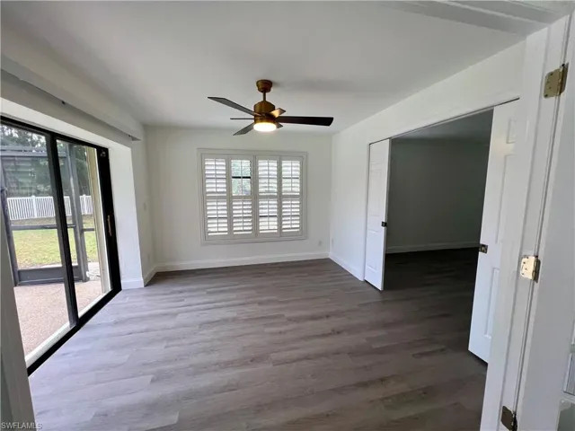 Den off of the primary bedroom with luxury vinyl plank floors.