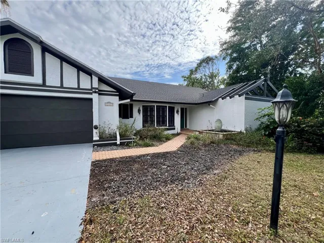 Single story home featuring a garage