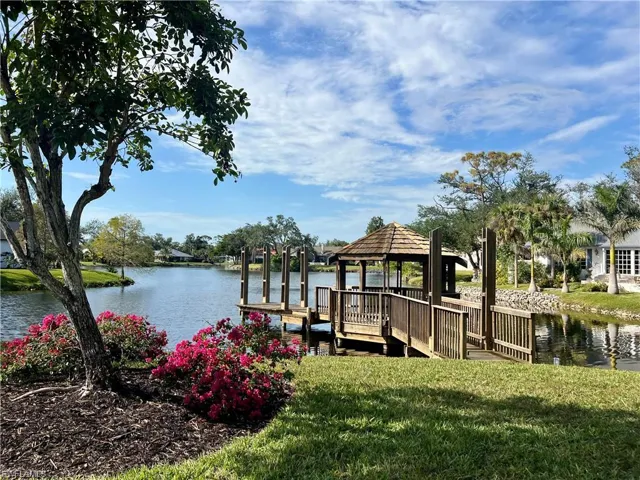 View of dock featuring a gazebo, a water view, and a fishing pier.