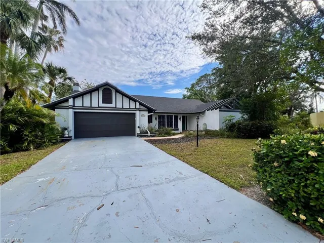 Front of home with long driveway with plenty of parking.