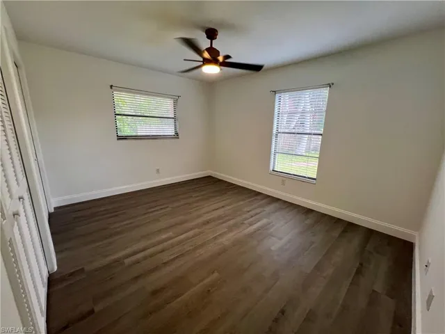 Guest bedroom with luxury vinyl plank floors.