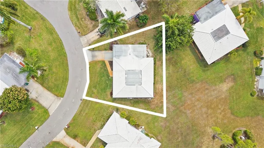Aerial view of property and surrounding area with property parcel outlined