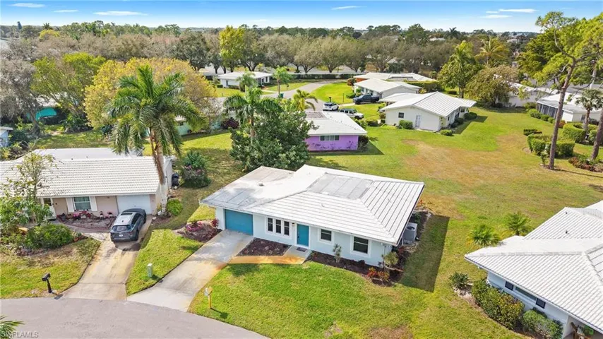 Aerial perspective of suburban area with a tree filled landscape