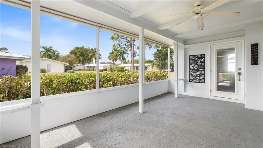 Unfurnished sunroom with a ceiling fan