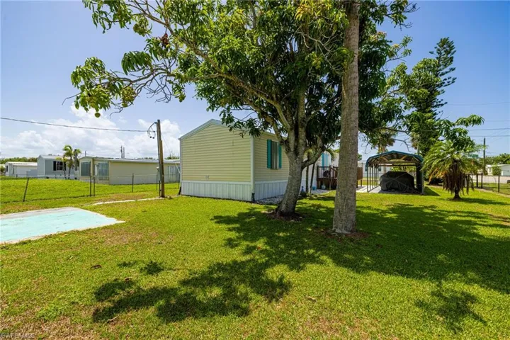 View of yard with a carport