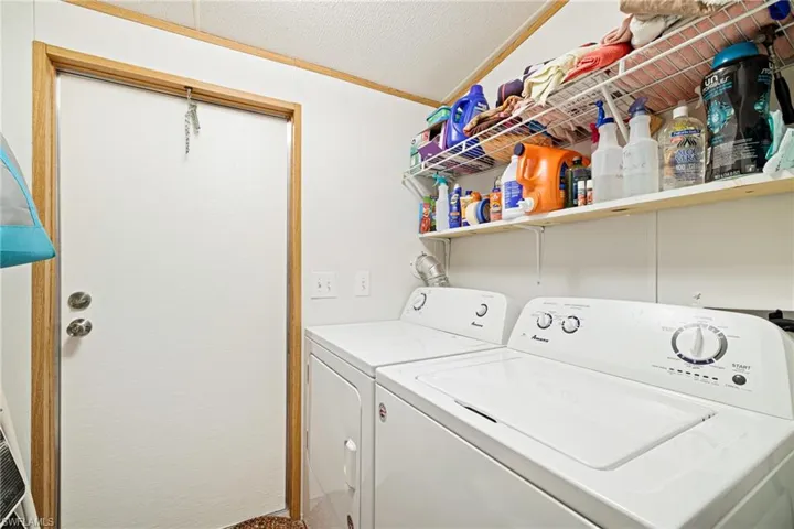 Laundry room featuring separate washer and dryer