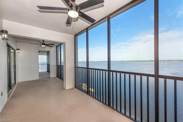 Unfurnished sunroom with a water view