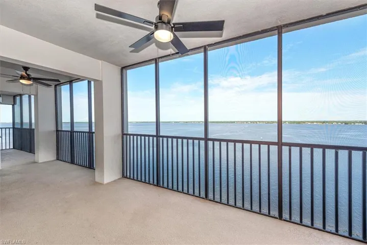 Unfurnished sunroom with a water view