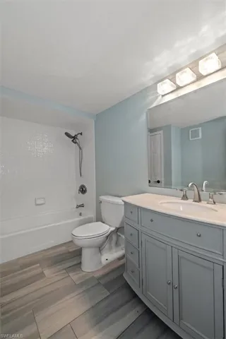 Bathroom featuring vanity and shower / tub combination