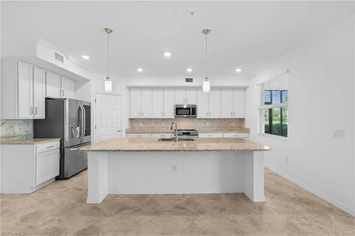 Kitchen with a sink, white cabinetry, visible vents, and appliances with stainless steel finishes