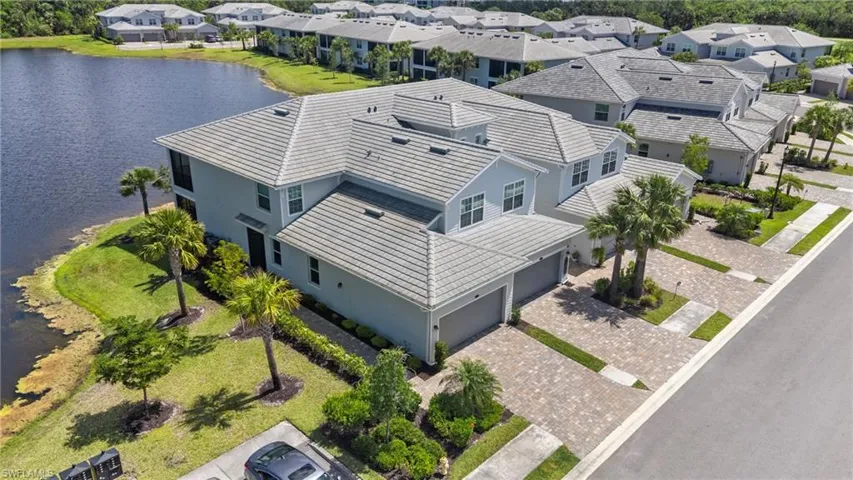 Drone / aerial view featuring a water view and a residential view