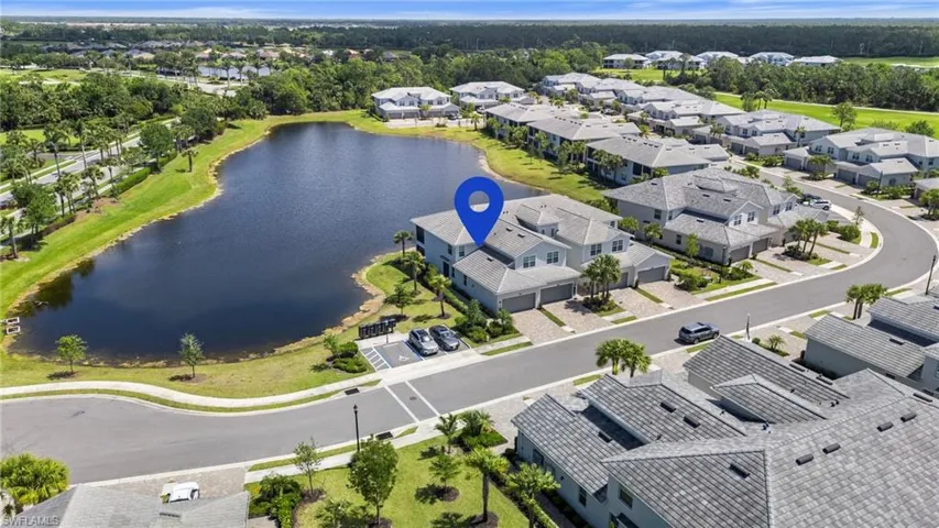 Aerial view featuring a residential view and a water view