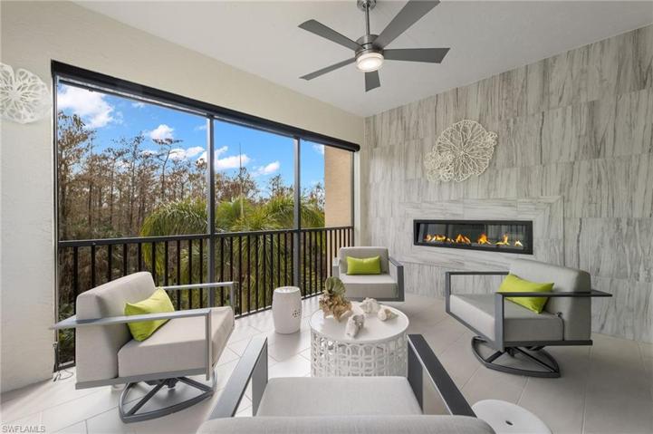 Screened loggia with electric fireplace.