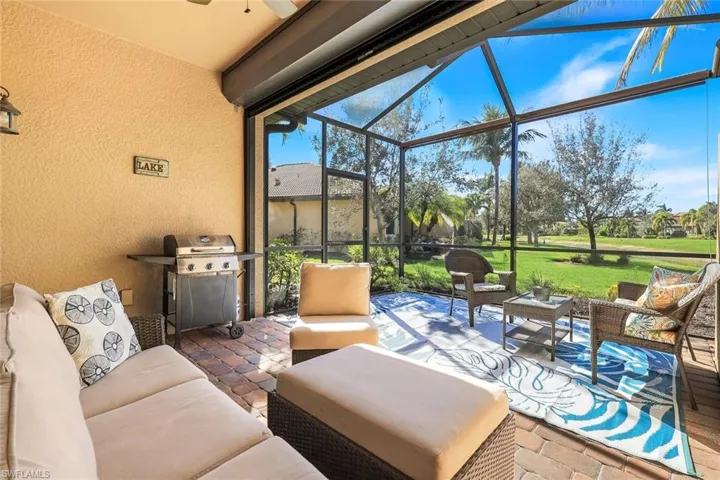 Sunroom featuring outdoor lounge area, a ceiling fan, and a patio