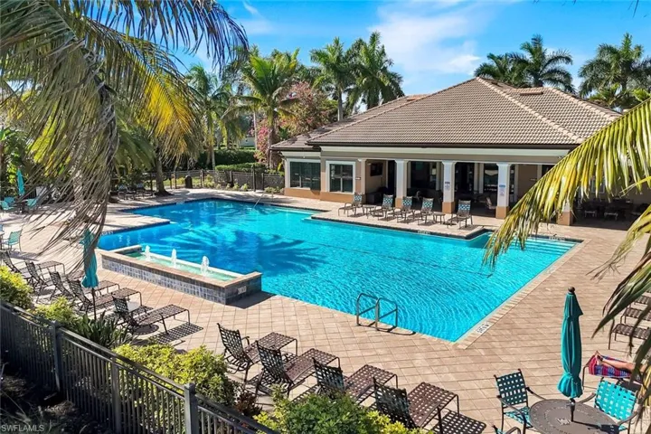 Community pool with a patio