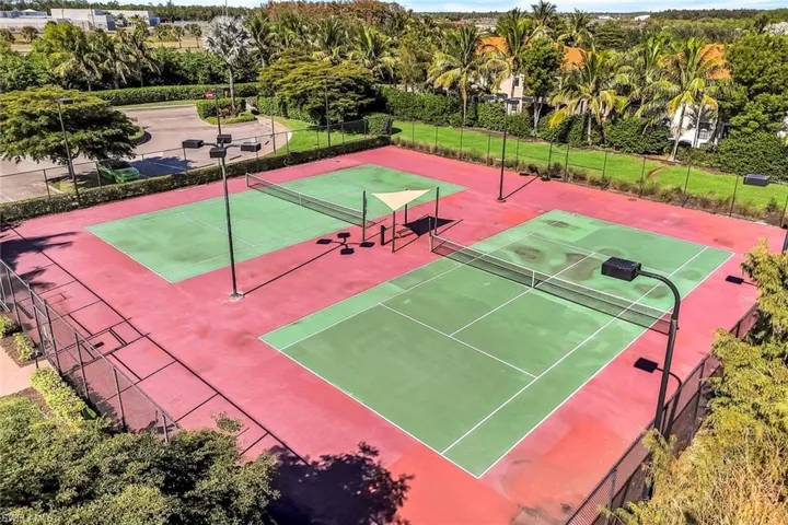 View of tennis court with community basketball court