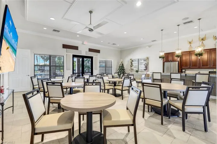 Dining area with recessed lighting, crown molding, and a ceiling fan