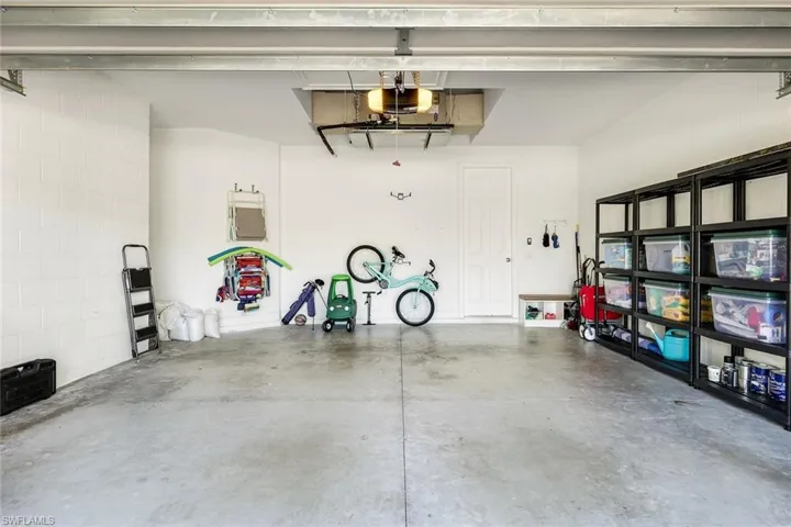 Garage featuring a garage door opener
