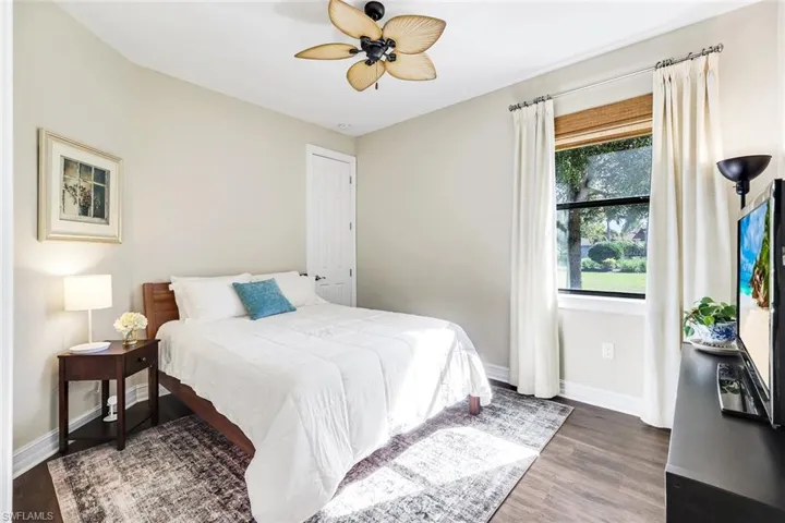 Bedroom featuring wood finished floors and a ceiling fan