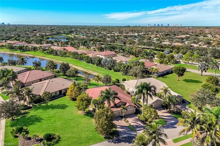 Aerial perspective of suburban area with a large body of water