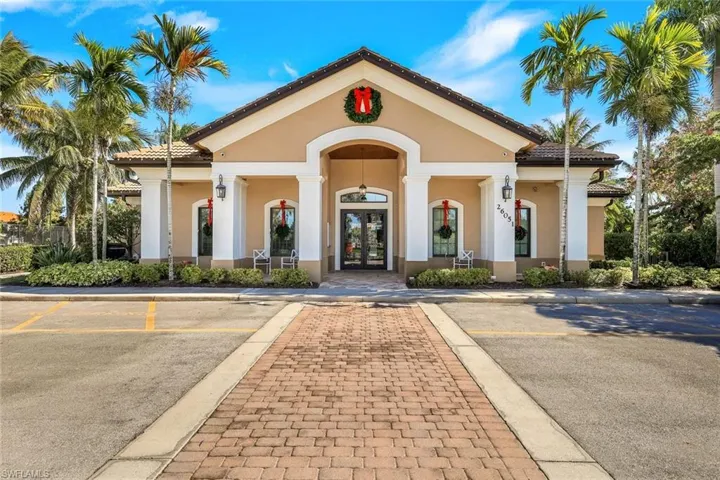 View of property featuring uncovered parking