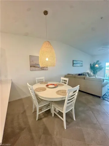 Dining room featuring lofted ceiling