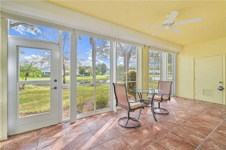 Sunroom / solarium with a water view