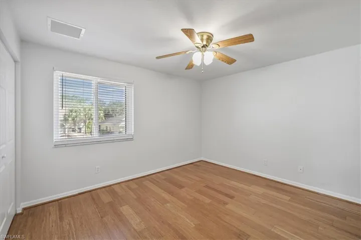 Unfurnished room with light wood-style flooring and a ceiling fan