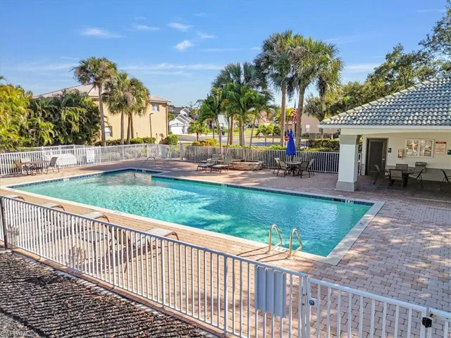 Community pool featuring a patio