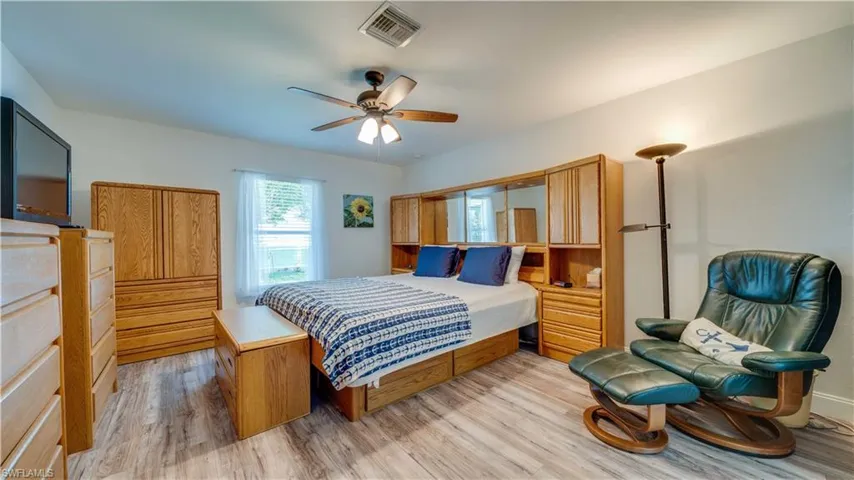 Bedroom with light wood-type flooring and ceiling fan