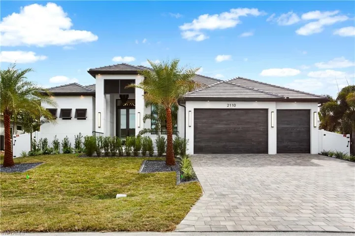 FEATURING 4 BEDS, den/OFFICE/study, 3 FULL BATHS & 2 HALF-BATHS, SCREENED LANAI