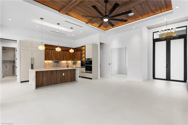 STRIKING ENTRYWAY w/ BOLD BLACK GORGEOUS CHANDELIER setting stage for EXTRAORDINARY LIVING EXPERIENCE!