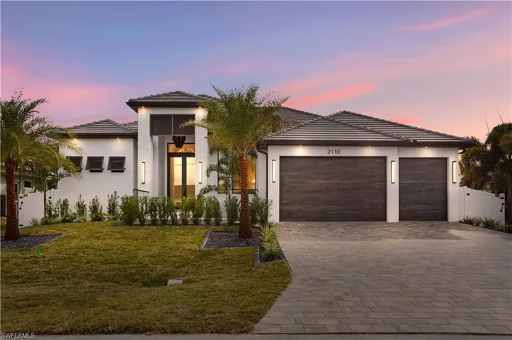 EXCEPTIONAL OPPORTUNITY to OWN CONTEMPORARY LUXURY OASIS in the HEART of DESIRABLE SW Cape Coral PARADISE